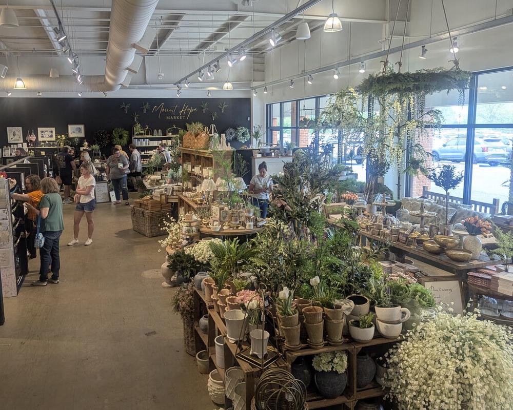 The numerous vendors are arranged across two levels, spearated by a ramp or stairs.
