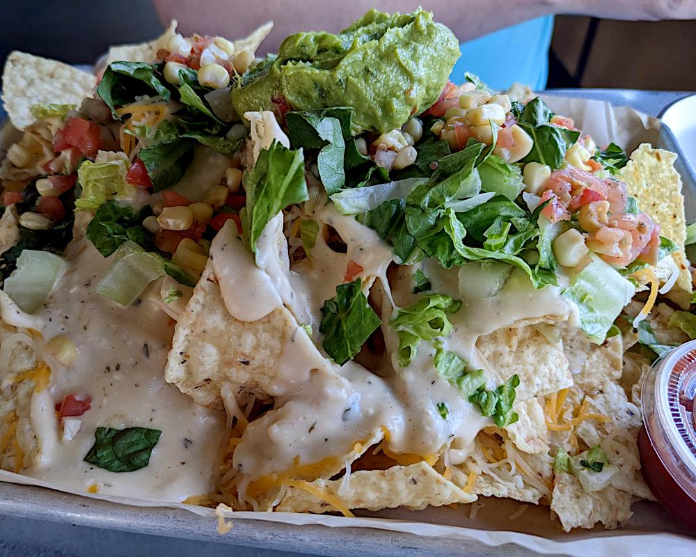 The nachos are generous for a meal, or to share with the whole table.