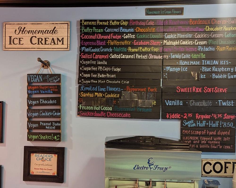 Review the board to see the current vegan and traditional ice cream flavors.