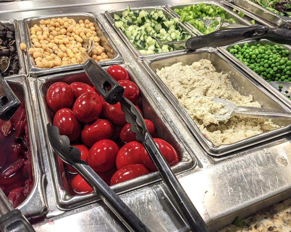 The salad bar includes local favorites pickled beet eggs, chow chow, and hot bacon dressing.